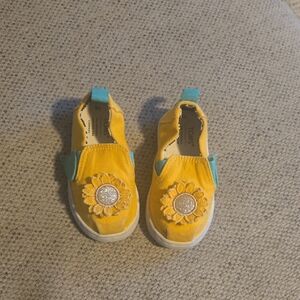 TOMS Kids Yellow Slip-On Shoes with Sunflower Design